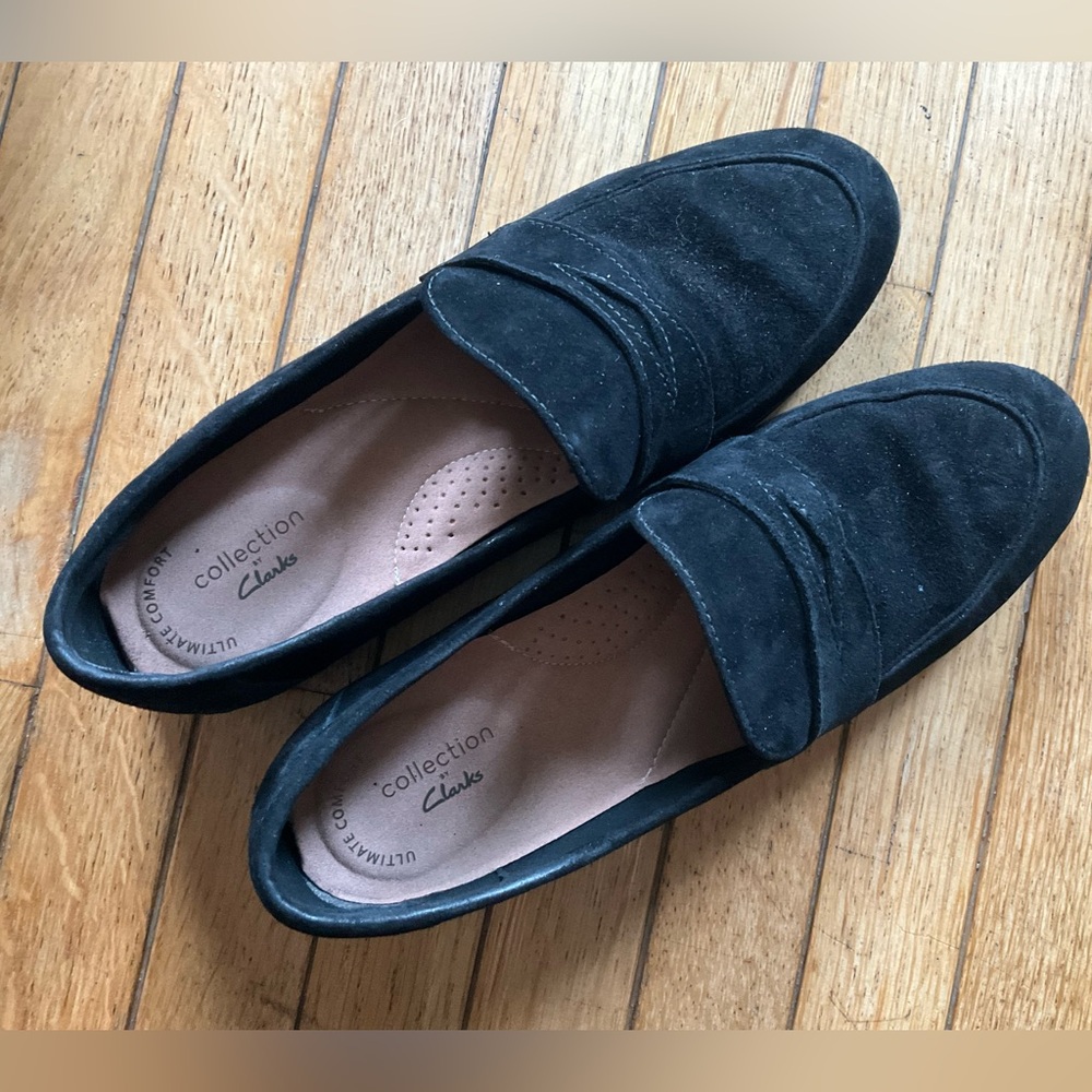 Clark’s black suede loafers.